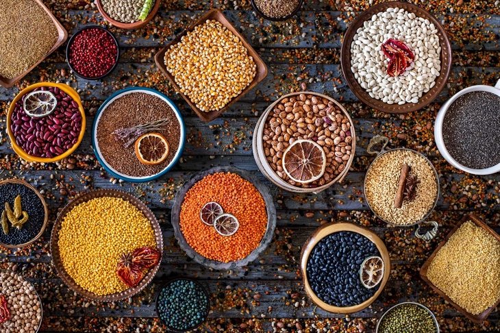 Many kinds of dried legumes on the table. Dried healthy foods concept.
